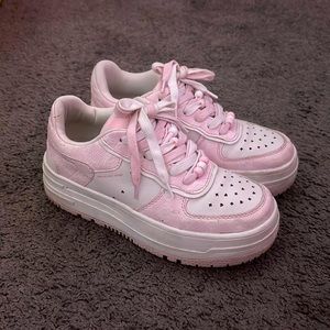 selling pink and white shoes with little heart and stars